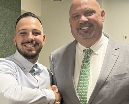 Client with attorney Mark Anthony Raimondo following a favorable case resolution